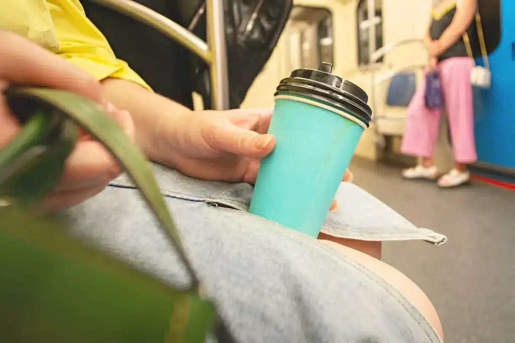 leak coffee cup in women hand